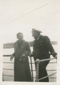 Image of Miriam MacMillan talking with captain of mail boat